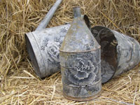 Severija Incirauskaite-Kriauneviciene, „Between city and village”, 2008, metal pail, watering-can, can, cotton, cross-stitch, wring, 25 x 25 x 20 cm, 45 x 41 x 23 cm, 25 x 35 x 20 cm
